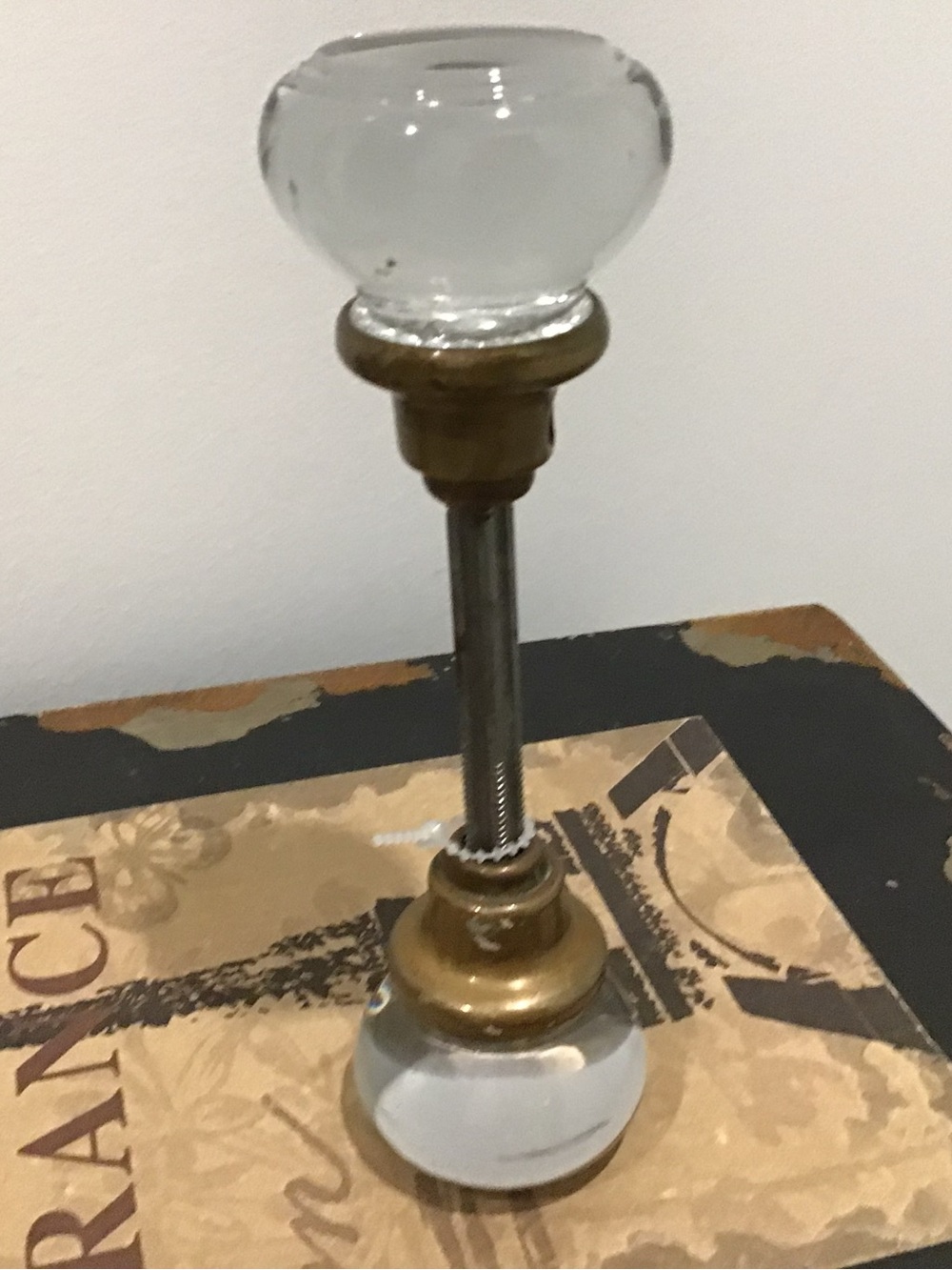 (301) Vintage door knobs. Clear with cut glass design. Brass bases and shaft.